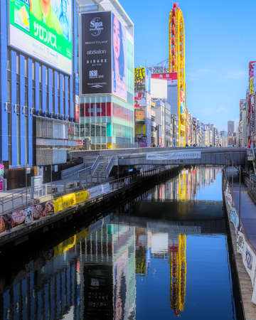Osaka, Japan - November 5 2020: Daytime view of the Dotonbori River running through central Osaka, lined with colorful signs and high-risesのeditorial素材