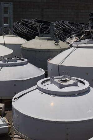 Microwave parabolas with reused radomes collected on the floorの写真素材