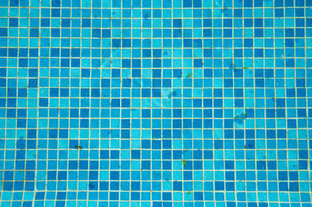 Detail of blue mosaic tile covered pool
