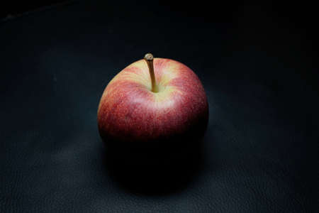 red apple on black backgroundの写真素材