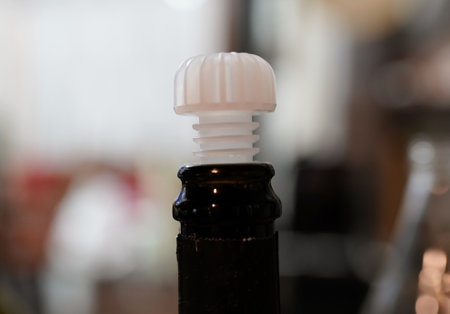 Close up of a bottle of beer in a pub or restaurant.の写真素材
