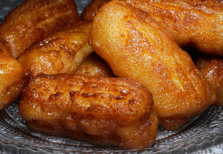 Close-up of a plate of deep-fried donuts.