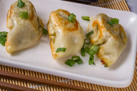 Gyoza is traditional Asian cuisine dish. Pasta with stuffing of beef, beef of pork or vegetables.の写真素材