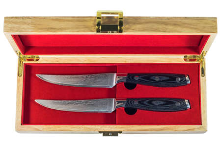 Steak knife set in a wooden box isolated on white backgroundの写真素材