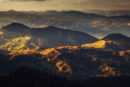 Mountain peaks at sunset. Panorama of mountain chain from a top viewの写真素材