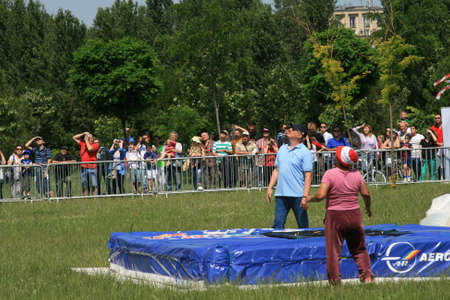 Skydiver Landing On The Ground With The Parachute Openのeditorial素材