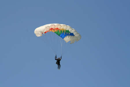 Skydiver Landing On The Ground With The Parachute Openの写真素材
