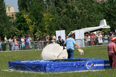 Skydiver Landing On The Ground With The Parachute Openのeditorial素材