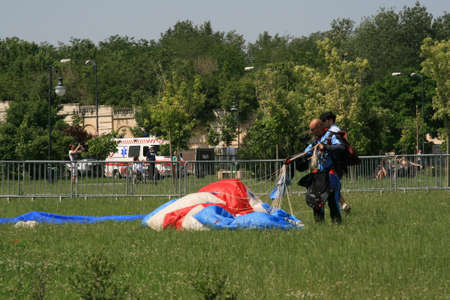 Skydiver Landing On The Ground With The Parachute Openのeditorial素材