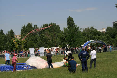 Skydiver Landing On The Ground With The Parachute Openのeditorial素材