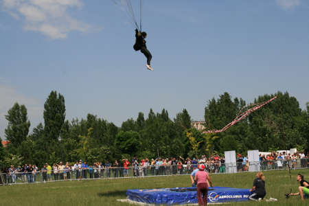 Skydiver Landing On The Ground With The Parachute Openのeditorial素材
