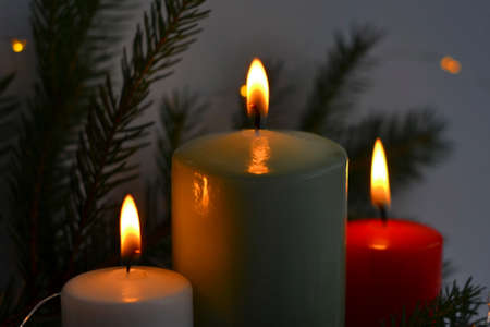 Christmas card with a candle. New year background with place for text, New Year 2022. Bright christmas tree. Christmas mock upの写真素材