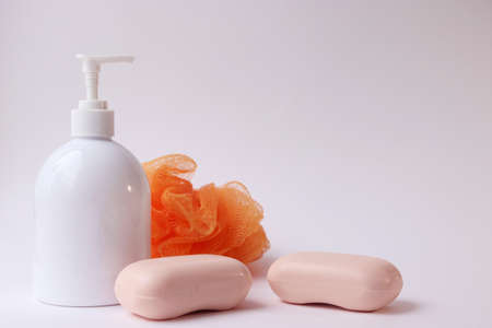 Body care products. Personal hygiene products. Soap and washcloth on a white background. Personal hygiene products on awhite backgroundの写真素材