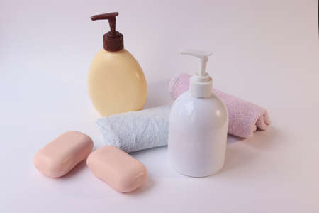 Body care products. Personal hygiene products. Soap and washcloth on a white background. Personal...
