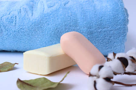 Body care products. Personal hygiene products. Soap and washcloth on a white background. Personal hygiene products on awhite backgroundの写真素材