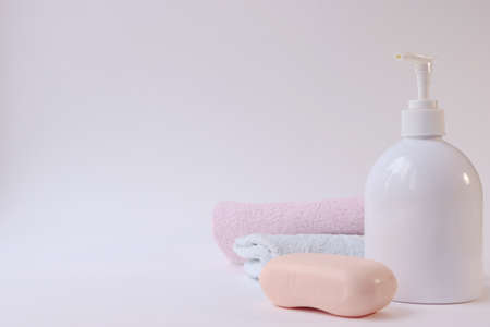 Body care products. Personal hygiene products. Soap and washcloth on a white background. Personal hygiene products on awhite backgroundの写真素材
