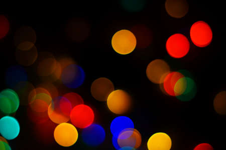 Christmas background with bokeh. Abstract background with bright bokeh. Dark abstract background. Valentines dayの写真素材