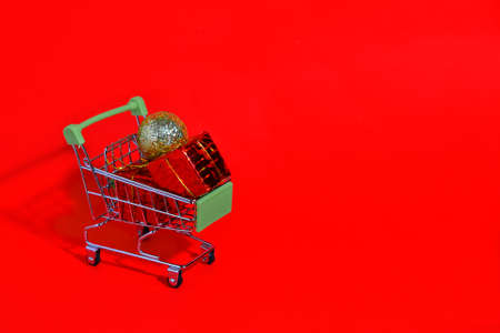 Buying gifts for Christmas. New Years sale. A cart with gifts for the new year. Shopping for gifts online. cyber mondayの写真素材