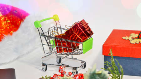 Buying gifts for Christmas. New Years sale. A cart with gifts for the new year. Shopping for gifts online. cyber mondayの写真素材
