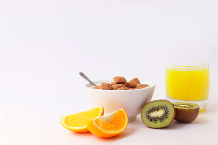Breakfast with fruit and sweet pillows. Ready breakfast on a white background. Healthy lifestyle.の写真素材