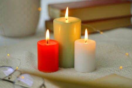 Home decor with candles. Decor with candles at home. Romantic greeting with candles. Hanukkah holidayの写真素材