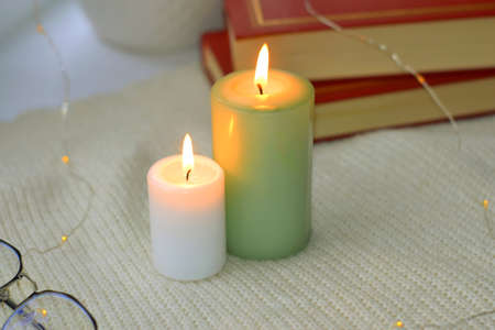 Home decor with candles. Decor with candles at home. Romantic greeting with candles. Hanukkah holidayの写真素材