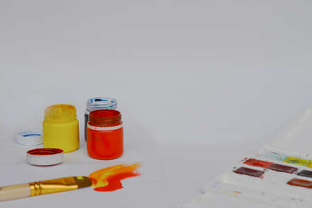 Drawing supplies. Back to school. Layout with drawing supplies. Artists workplace. Paints for drawing on a white backgroundの写真素材