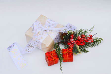 Christmas gift on a white background. New year card white place for text. New Years gift and colorful bokeh. DIY gift.の写真素材