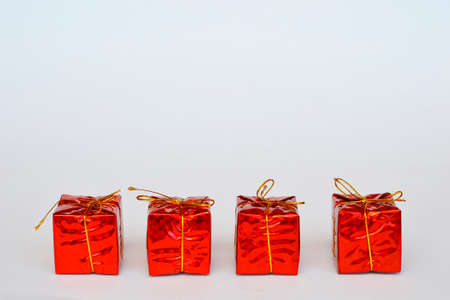 Christmas gift on a white background. New year card white place for text. New Years gift and colorful bokeh. DIY gift.の写真素材