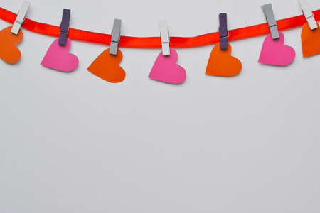 Valentines Day background. Paper hearts on a concrete background, top view. Valentines Day concept. Copy space for text, toned. High quality photoの写真素材