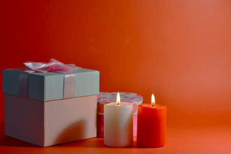 Valentines day banner. Two candel on the red background. Romantic background. High quality photoの写真素材