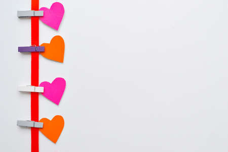 Valentines Day background. Paper hearts on a concrete background, top view. Valentines Day concept. Copy space for text, toned. High quality photoの写真素材