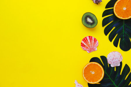Summer layout with space for text. Tropical fruits and leaves on a white background. Seashellsの写真素材