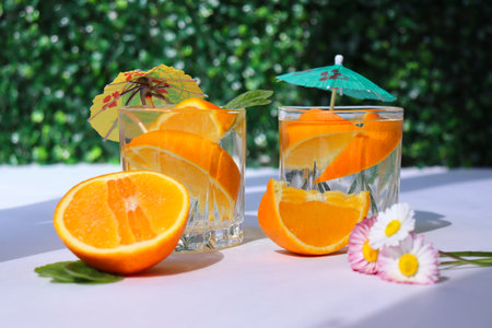A summer refreshing drink. Alcoholic drink with lemon. Healthy lifestyle. Water with lemon and mintの写真素材