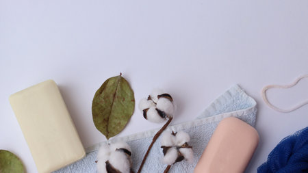 Body care products. Personal hygiene products. Soap and washcloth on a white background. Personal...