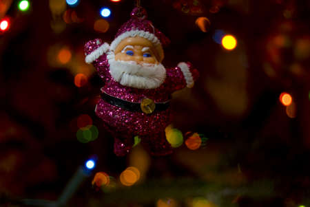 Santa Claus decoration inside the Christmas treeの写真素材