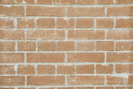 Brick wall background in warm terracote coloursの写真素材
