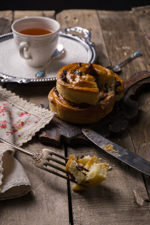 Tea with cinnamon Buns and raisinの写真素材
