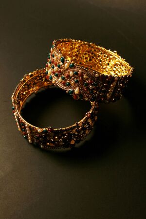 Bangle. Colorful traditional jewelry from India and Pakistan on black backgroundの写真素材