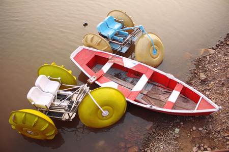 Boats in the water on a public place during sun set at Raval lake Islamabadの写真素材
