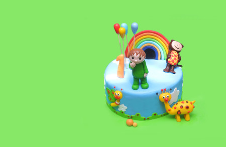 Rainbow color birthday cake with animals, isolatedの写真素材