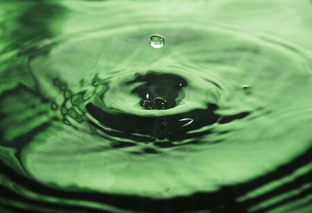 Water Drop impact on water surface - Droplet Photographyの写真素材