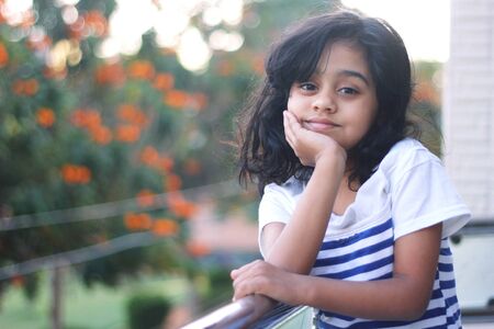 Adorable little girl posing for the photographの写真素材
