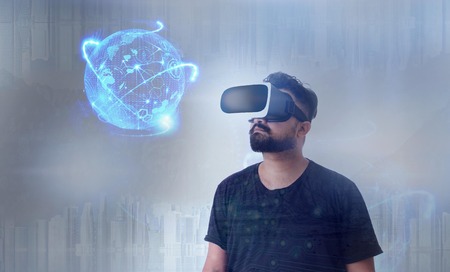 Guy looking through VR (Virtual Reality) glasses - Looking into the Future