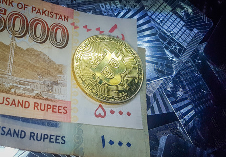 Golden BitCoin On The Five Thousand And One Thousand Pakistani Rupees Note