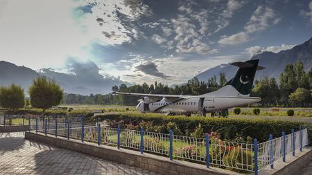 Plane standing at the runway after landing, at beautiful airport of Gilgit Baltistan, Pakistan...