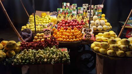 Fresh and healthy fruits on a stall at night in Sadar Bazar, Karachi, Pakistan 02/04/2019のeditorial素材