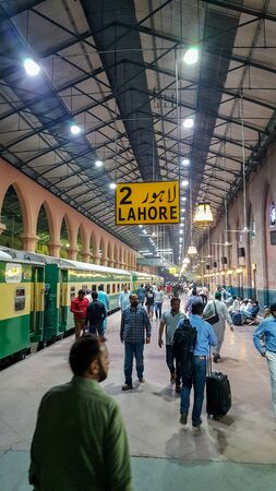 Passengers waiting for their train at Lahore Station, Pakistan At Night 03/05/2019のeditorial素材