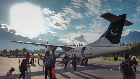 Passengers coming out of plane at the runway after landing, at beautiful airport of Gilgit Baltistan, Pakistan 15/08/2019のeditorial素材