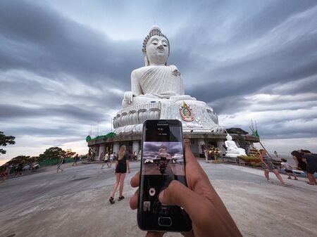 Taking Picture Of Big Buddha Statue - Maravija Buddha statue On Nakkerd Hill, Phuket, Thailand 20/11/2019のeditorial素材